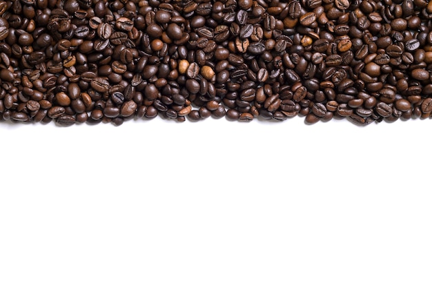 Photo white background with coffee beans on the side. view from above with space for text. still life. mock-up. flat lay