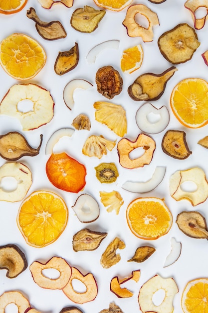 A white background with fruits and nuts on it.