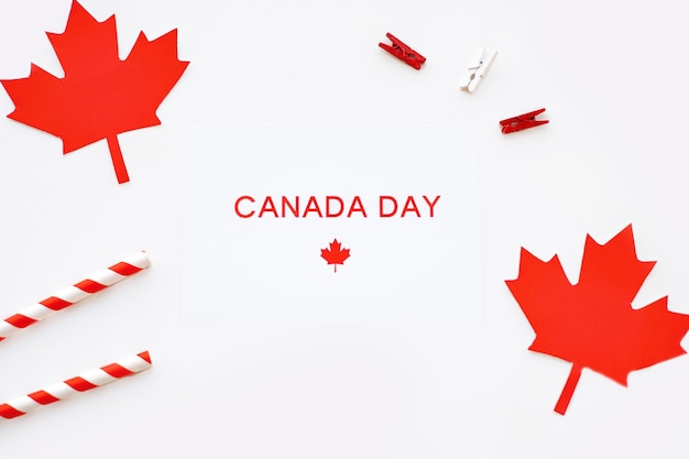 Photo a white background with a red maple leaf and the word canada on it.