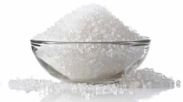 White background with sugar in a glass bowl