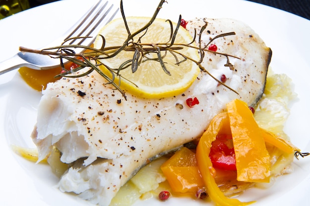 White baked cod with pepper and rosemary