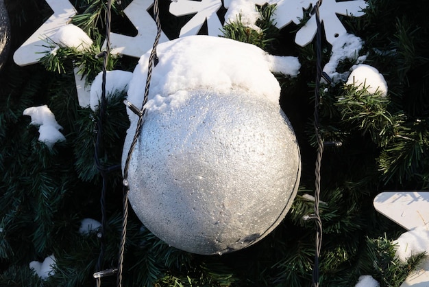 White ball on a street Christmas tree