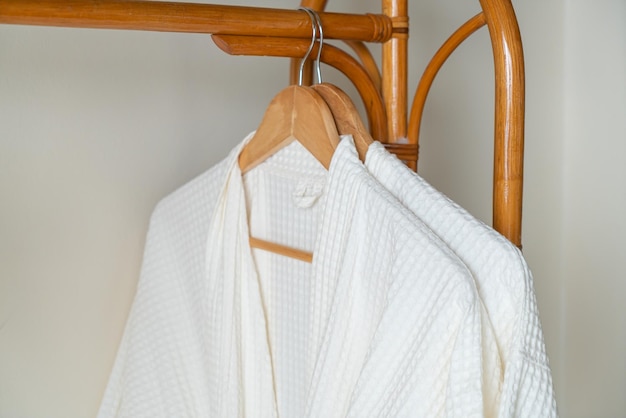 white bathrobe hanging in bathroom
