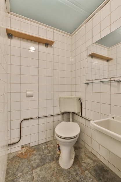 A white bathroom with a toilet and a sink