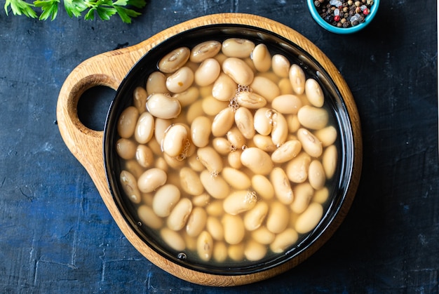 white beans cooked ready to eat beans boiled legumes on the table