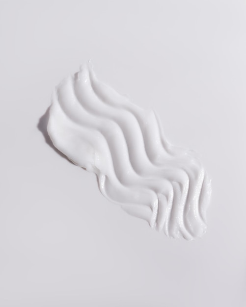 白い美容クリームの汚れ 化粧品のスキンケア製品のテクスチャー フェイス クリーム ボディ ローションのスワイプ スウォッチ