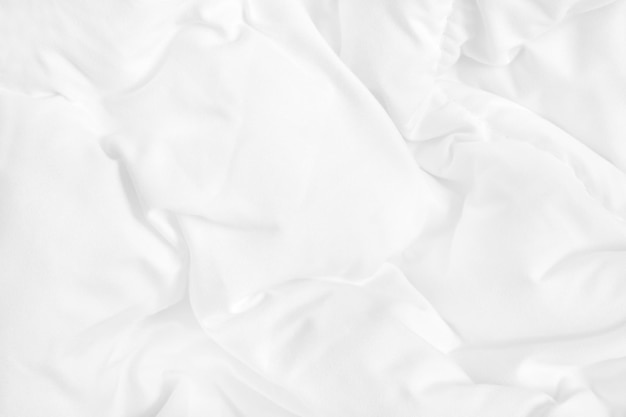 White bedding sheet and wrinkle messy blanket in bedroom after wake up in the morning