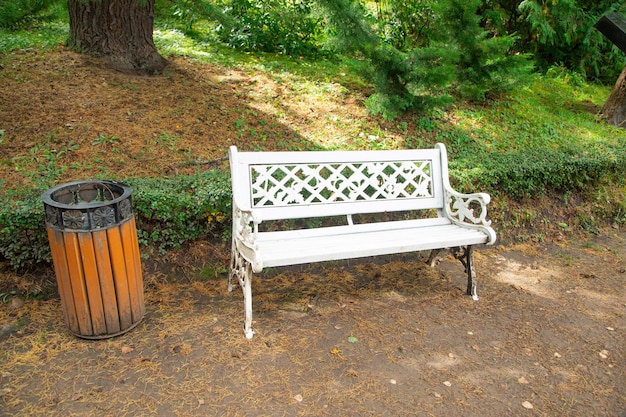 White bench in green park