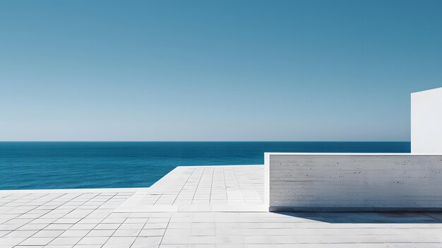 a white bench on a white wall overlooking the ocean