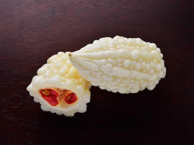 White bitter cucumber on wooden background