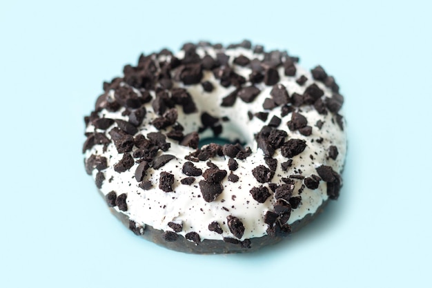 White and black donut or doughnut with cookies crumbs