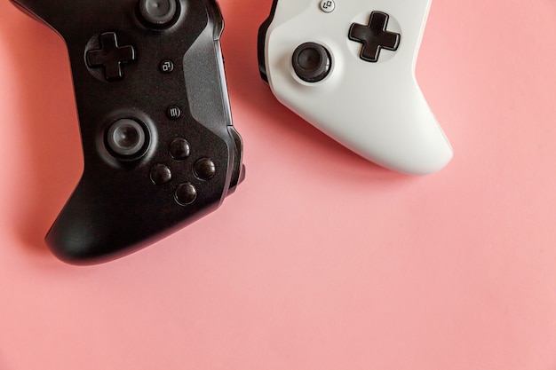 White and black two joystick on pink 