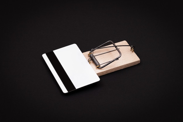 White blank credit card template in wooden mouse trap