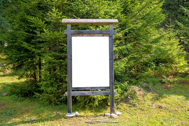 White blank sign board in the green park