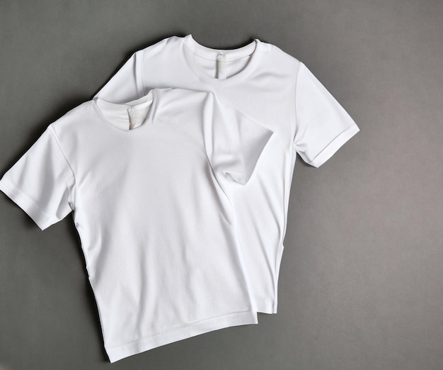 white blank t shirt on grey background