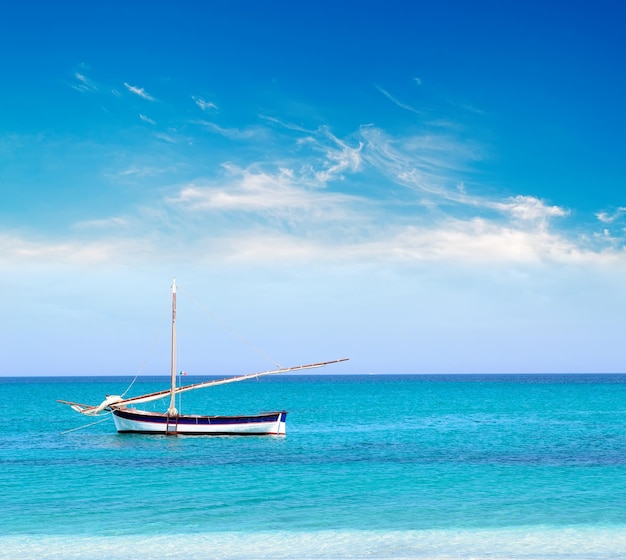 White and blue boat on a calm sea