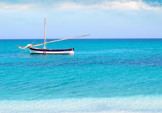 White and blue boat on a calm sea