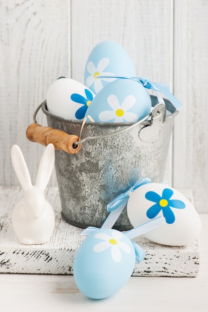 White blue easter eggs, bucket