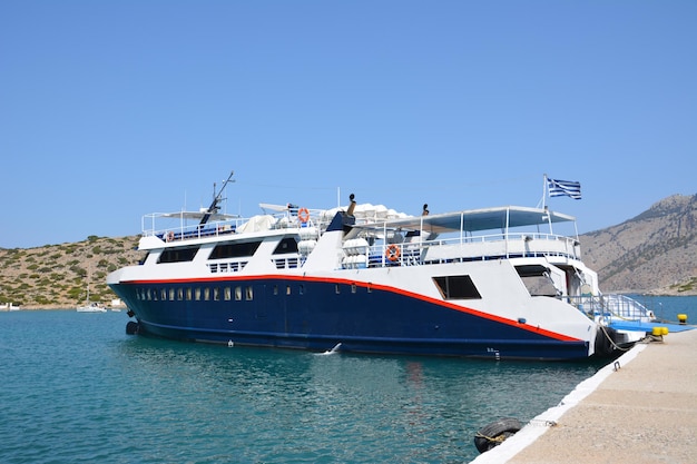 white and blue ferryboat in aegean sea, close-up