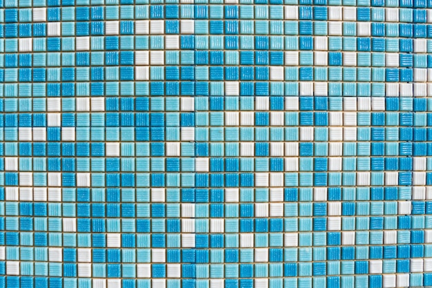 White and blue mosaic tile with white seams on a round surface