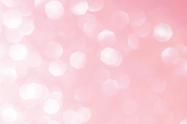 White bokeh lights in pink background