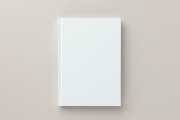 White book blank cover mockup on a beige background flat lay mockup