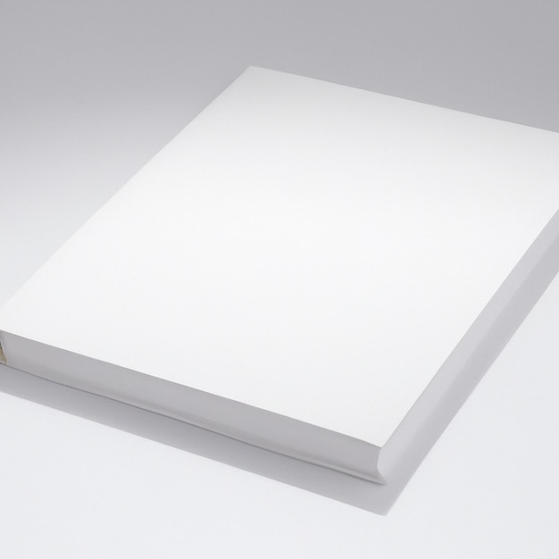 白い表紙の白い本が白い表面にあります