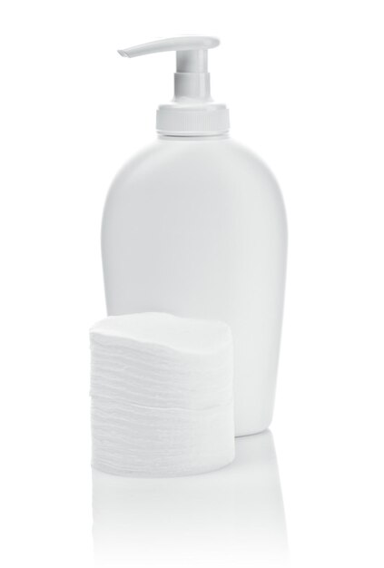 White bottle and cotton pads