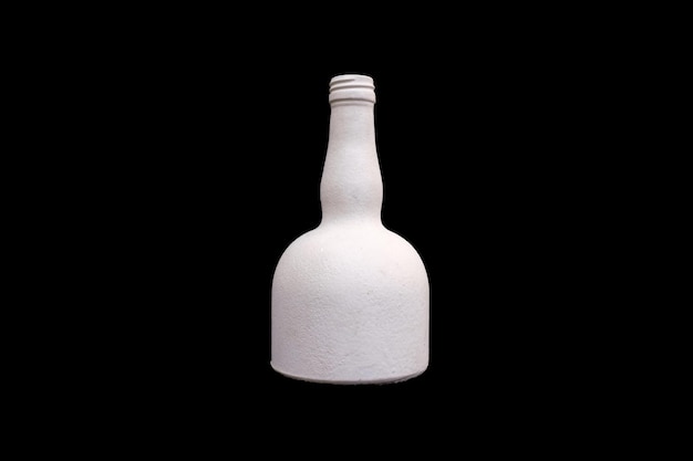 Белая бутылка гипса изолирована на черном фоне Фото высокого качества