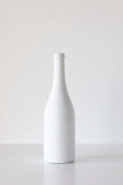 White bottle on white background minimalism concept