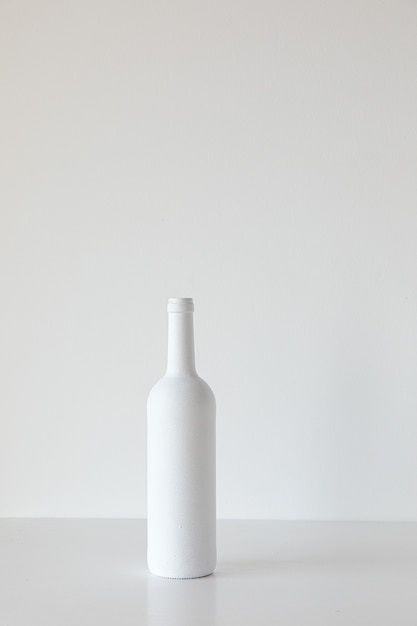 White bottle on white background minimalism concept