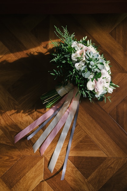 White bouquet of flowers lying on the floor