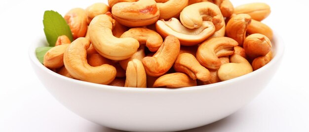 a white bowl filled with cashews on top of a table