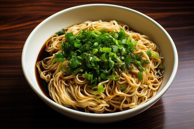 a white bowl filled with noodles and green onions