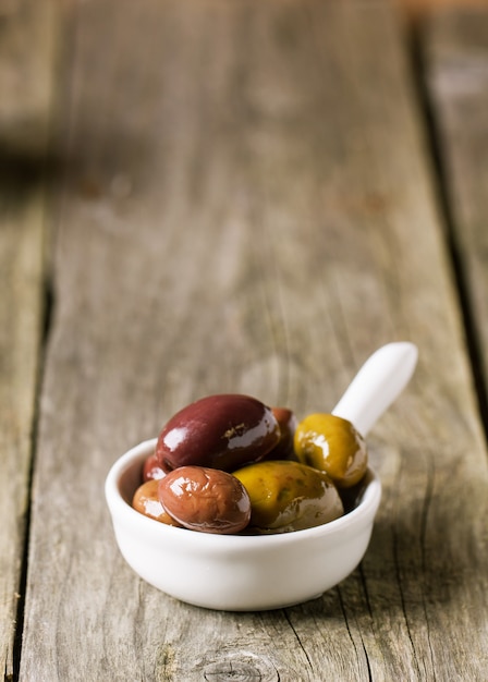 White bowl of olives