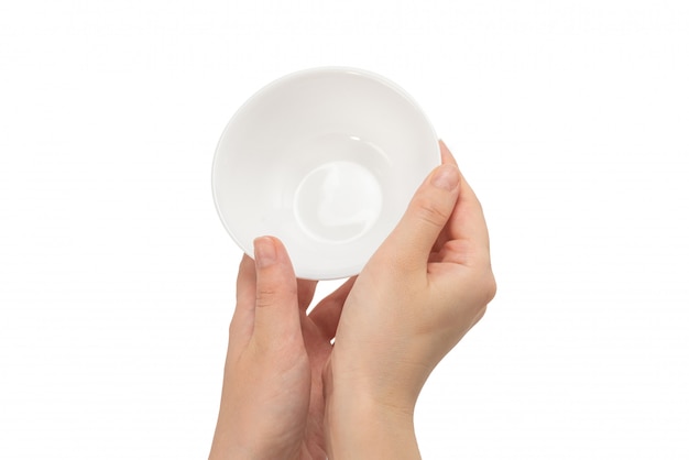 White bowl in woman hand isolated on white.