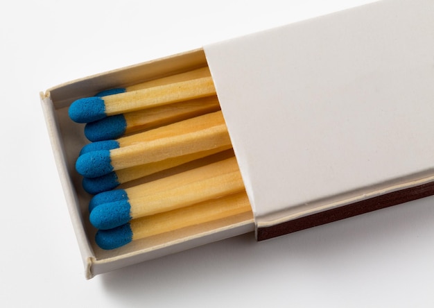 Photo white box of matches with blue tips