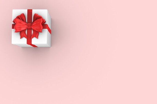 White box with red bow on pink.