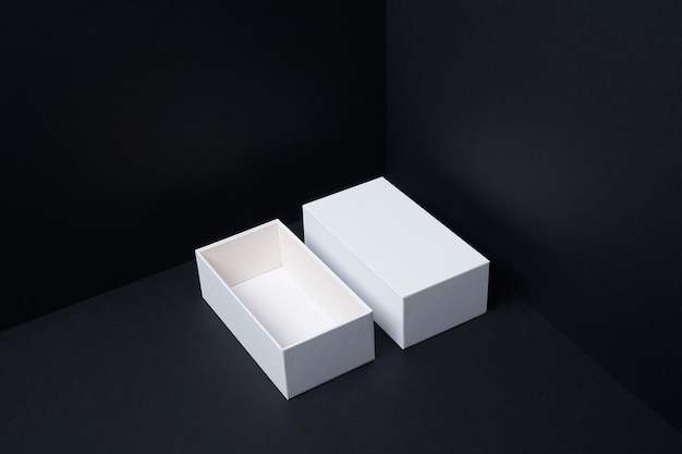 White boxes opened mockup display on black background. Top view