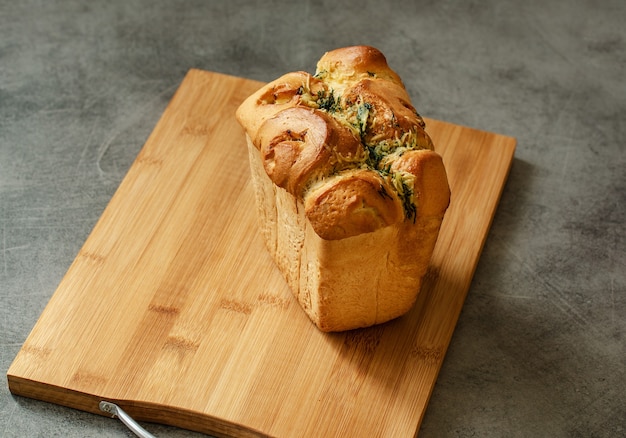 White bread loaf on the table. Neutral background