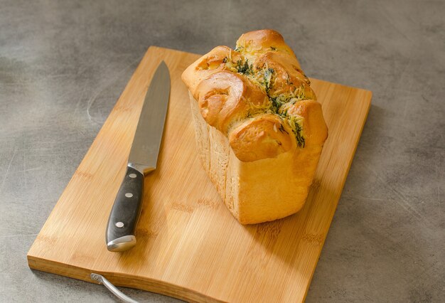 White bread loaf on the table. Neutral background