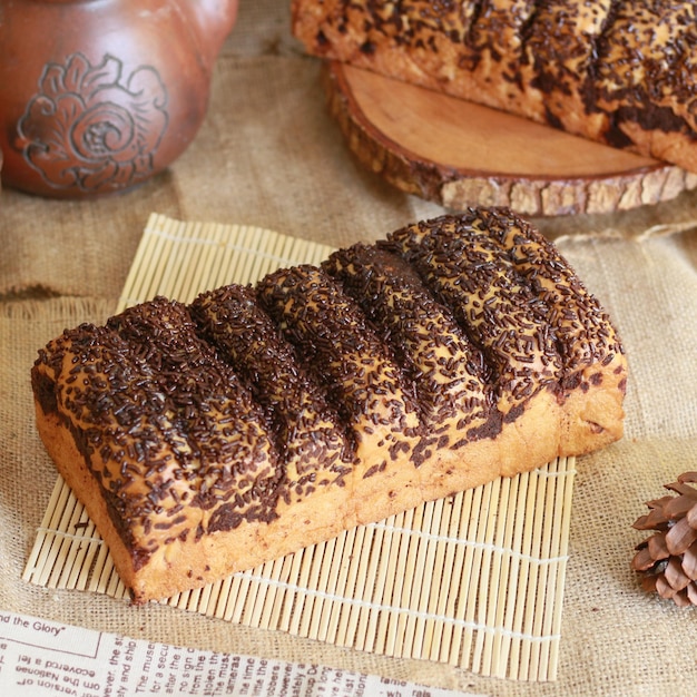 White bread spread with butter and sprinkled with meses ceres on top