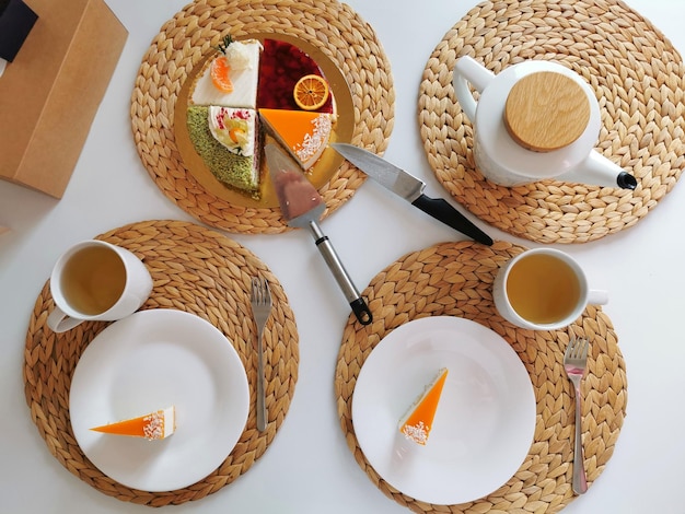 White breakfast table with fruit cake tea top view Festive table setting composition