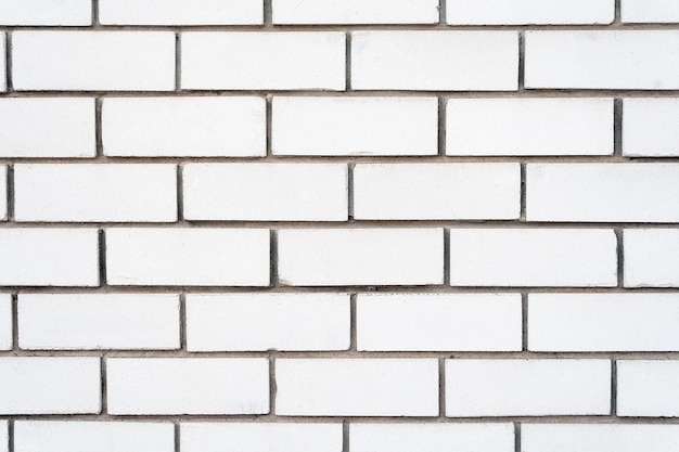 White brick background wall with cement grout