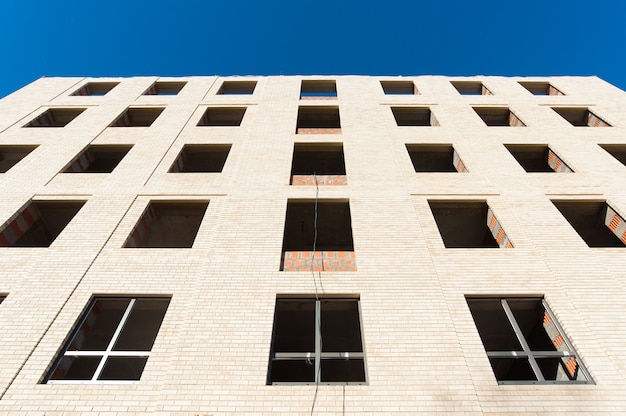 white brick masonry on a blue sky background