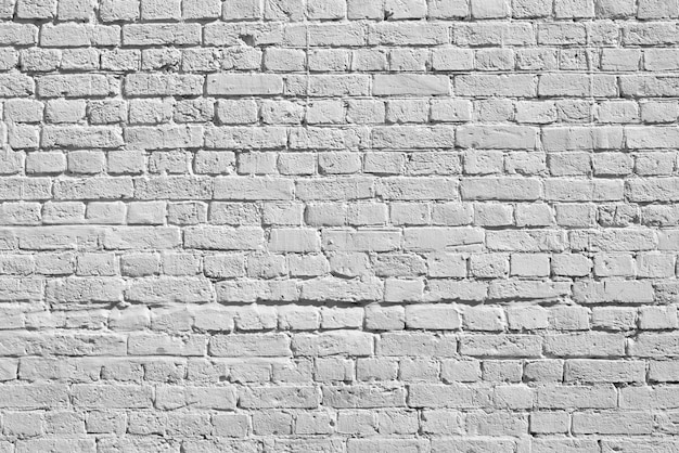 White brick wall. Loft interior design. White paint of the facade.