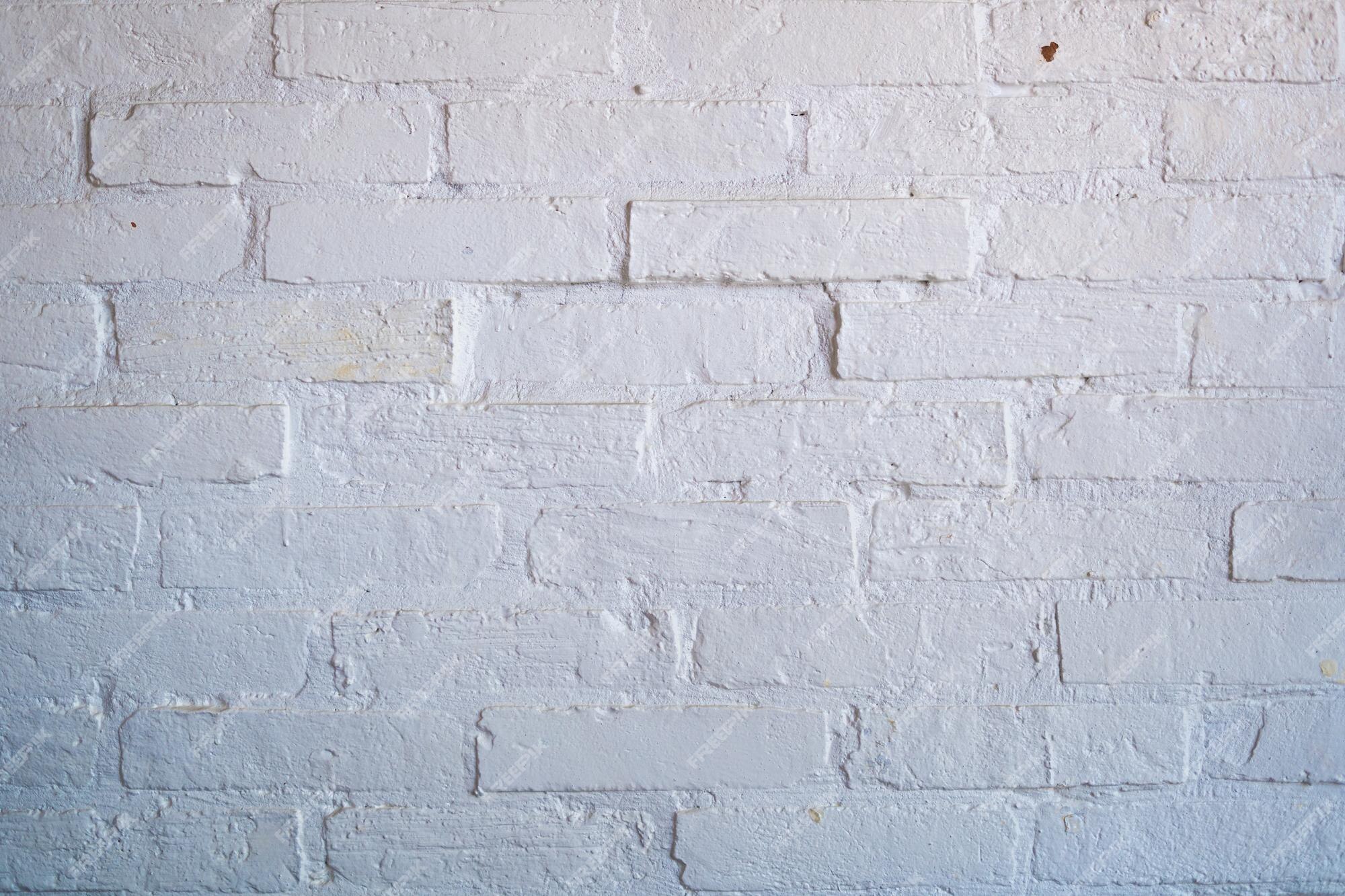 Premium Photo | White brick wall pattern gray color of modern style design  decorative uneven white brick wall