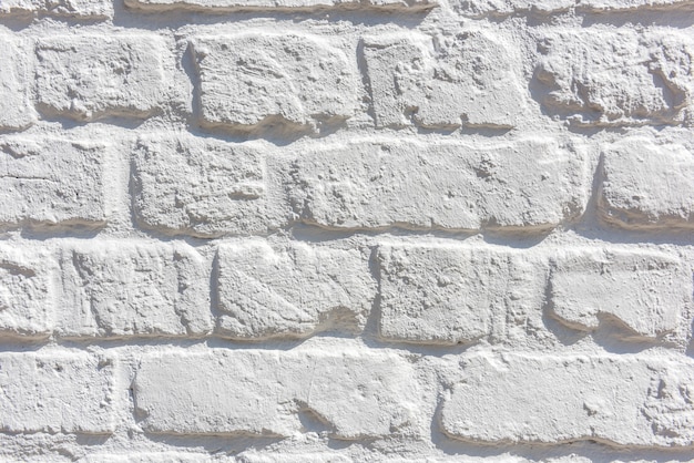 Белая предпосылка текстуры кирпичной стены. Горизонтальный снимок