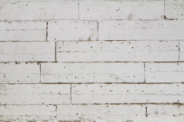 Фото Текстура белой кирпичной стены, используемая для создания фона, подходящего для интерьера и экстерьера