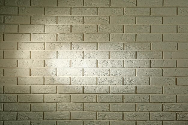 Photo a white brick wall with round shadow